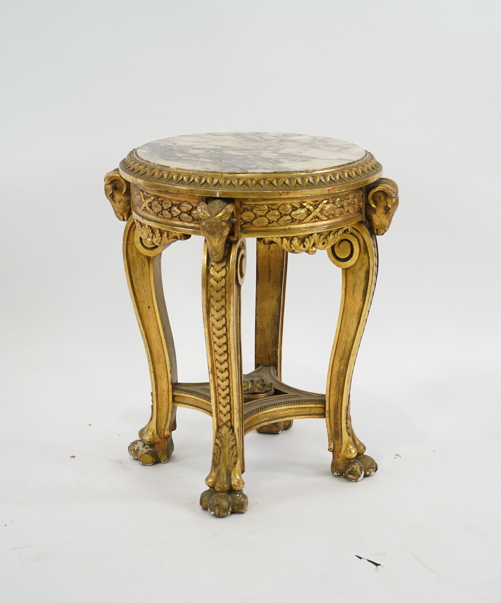 A late 19th century French circular carved giltwood and composition vase stand